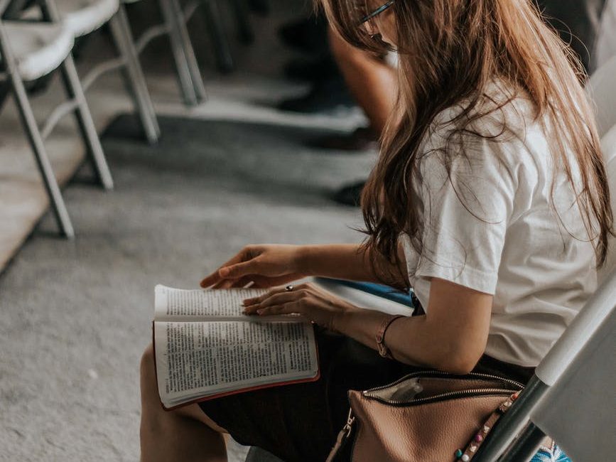 woman holding book